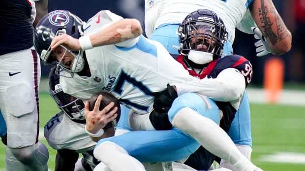 Ryan Tannehill is sacked by Houston Texans defensive end Derek Barnett (95) on a fourth down during the fourth quarter at NRG Stadium in Houston